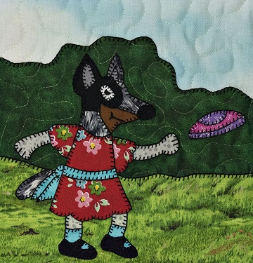 Puppy girl with flying disc by Ms P Designs USA